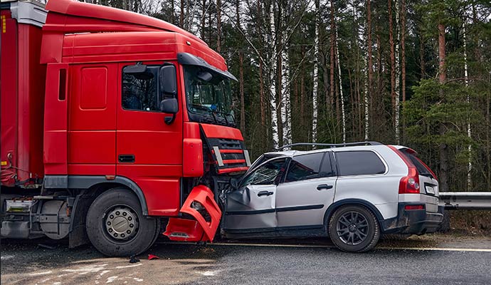 Red semi truck accidents silver car Red semi truck accidents silver car
